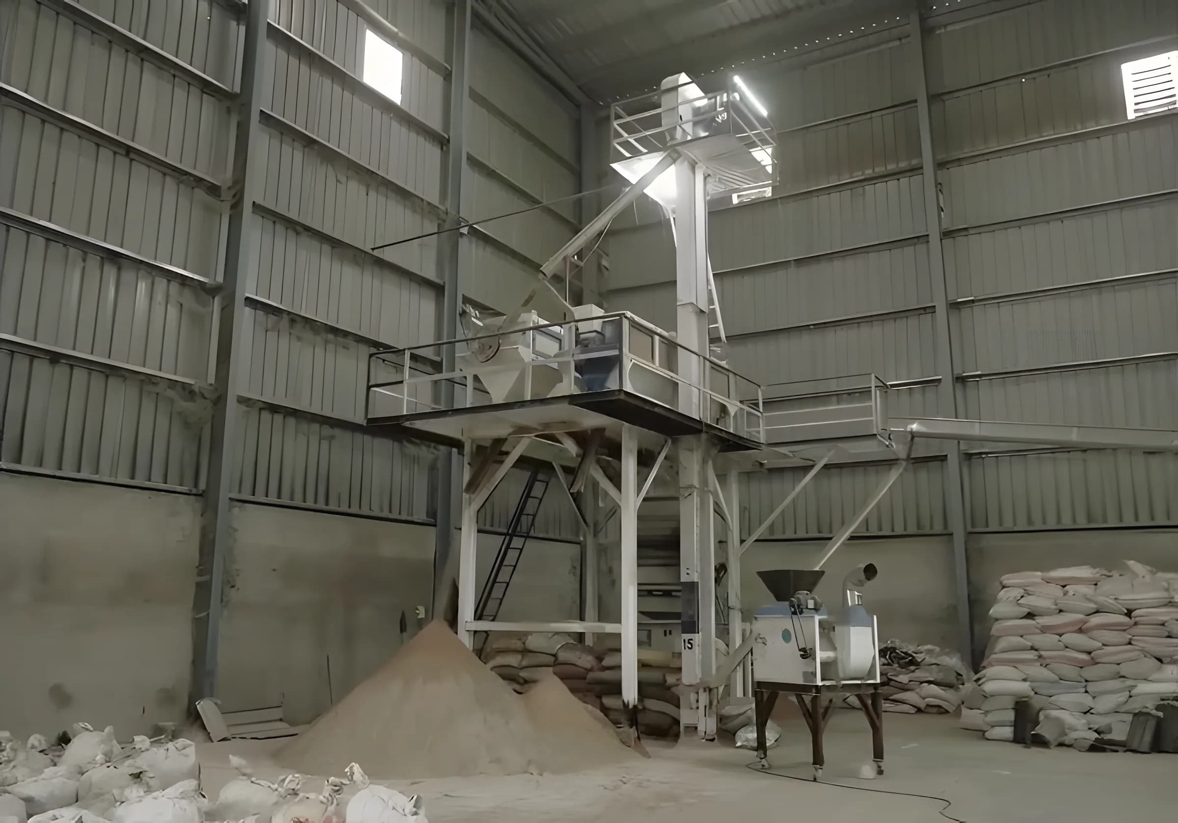 Warehouse hall with a bucket elevator