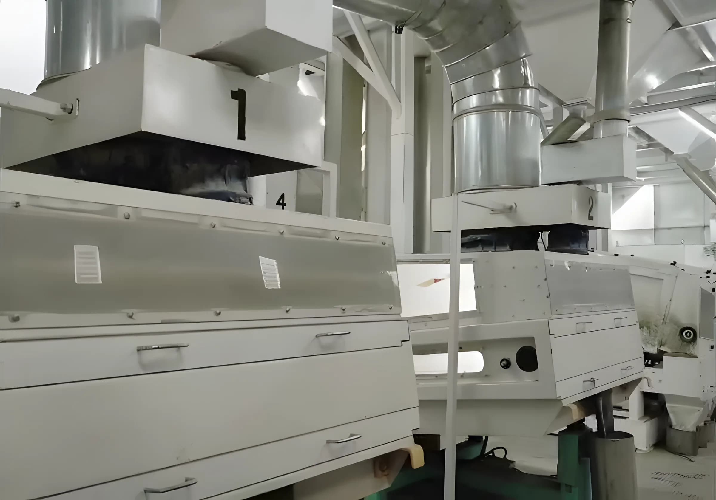 A row of rice grading machines